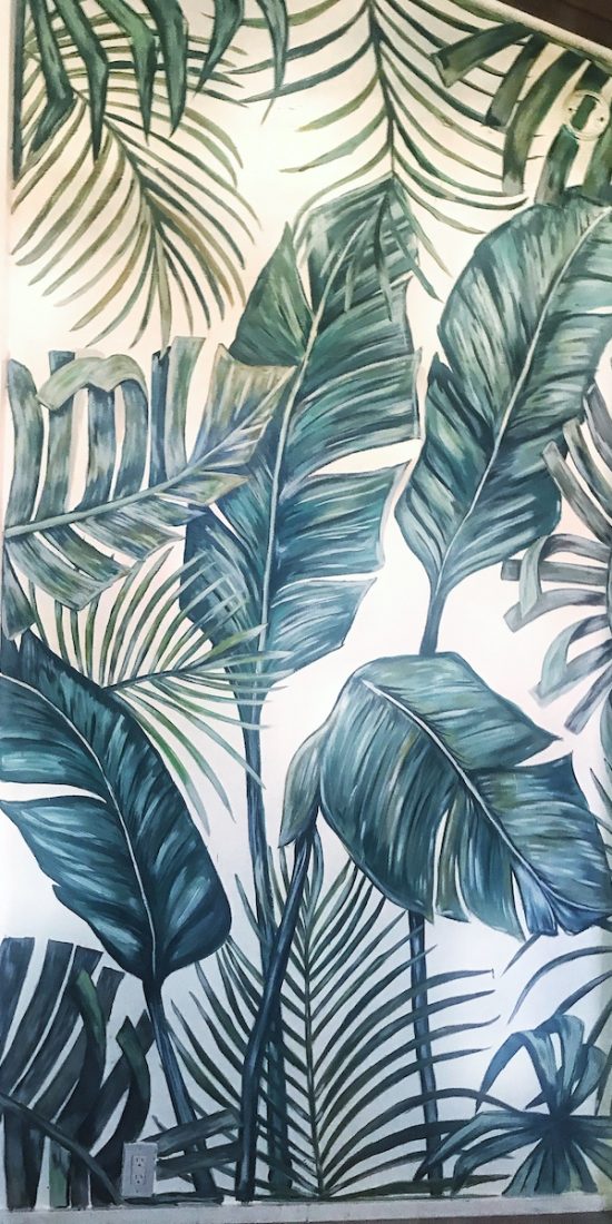 wall to wall foliage mural with banana leaf and palm leafs